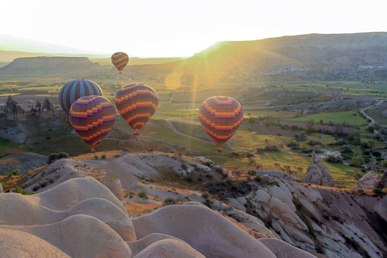 Air baloons flying at sunrise in Cappadocia